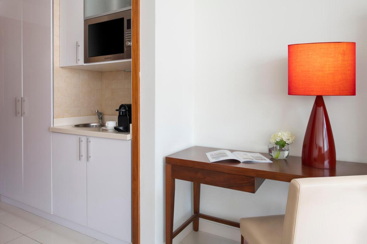 Fraser Suites Doha Exterior photo A kitchenette in a hotel room
