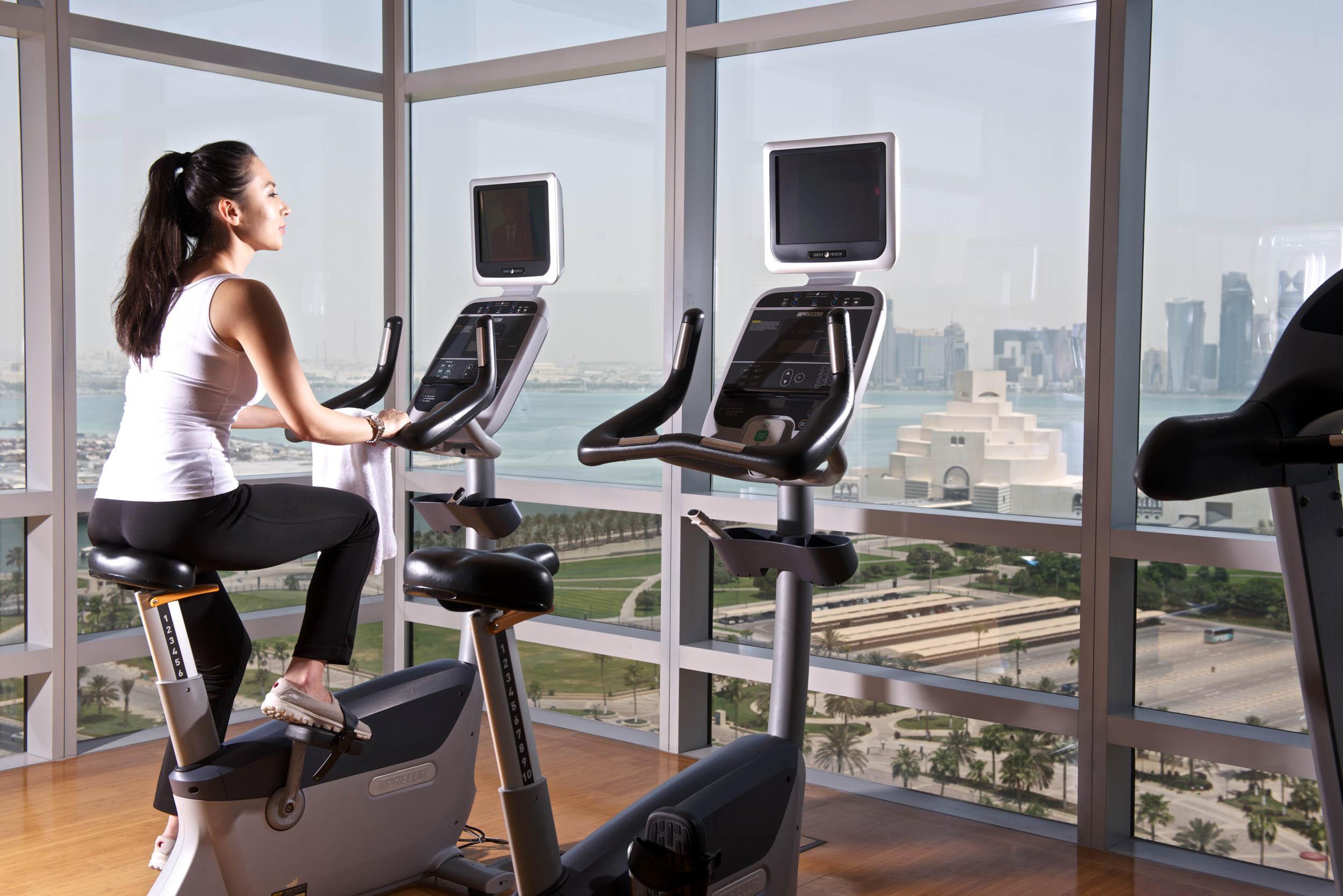 Fraser Suites Doha Exterior photo A woman on a stationary bicycle