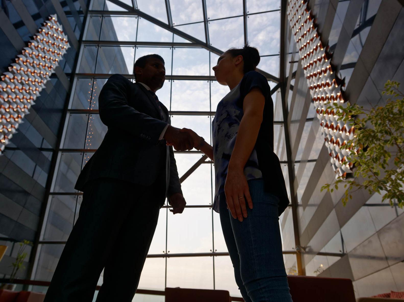 Fraser Suites Doha Exterior photo A handshake