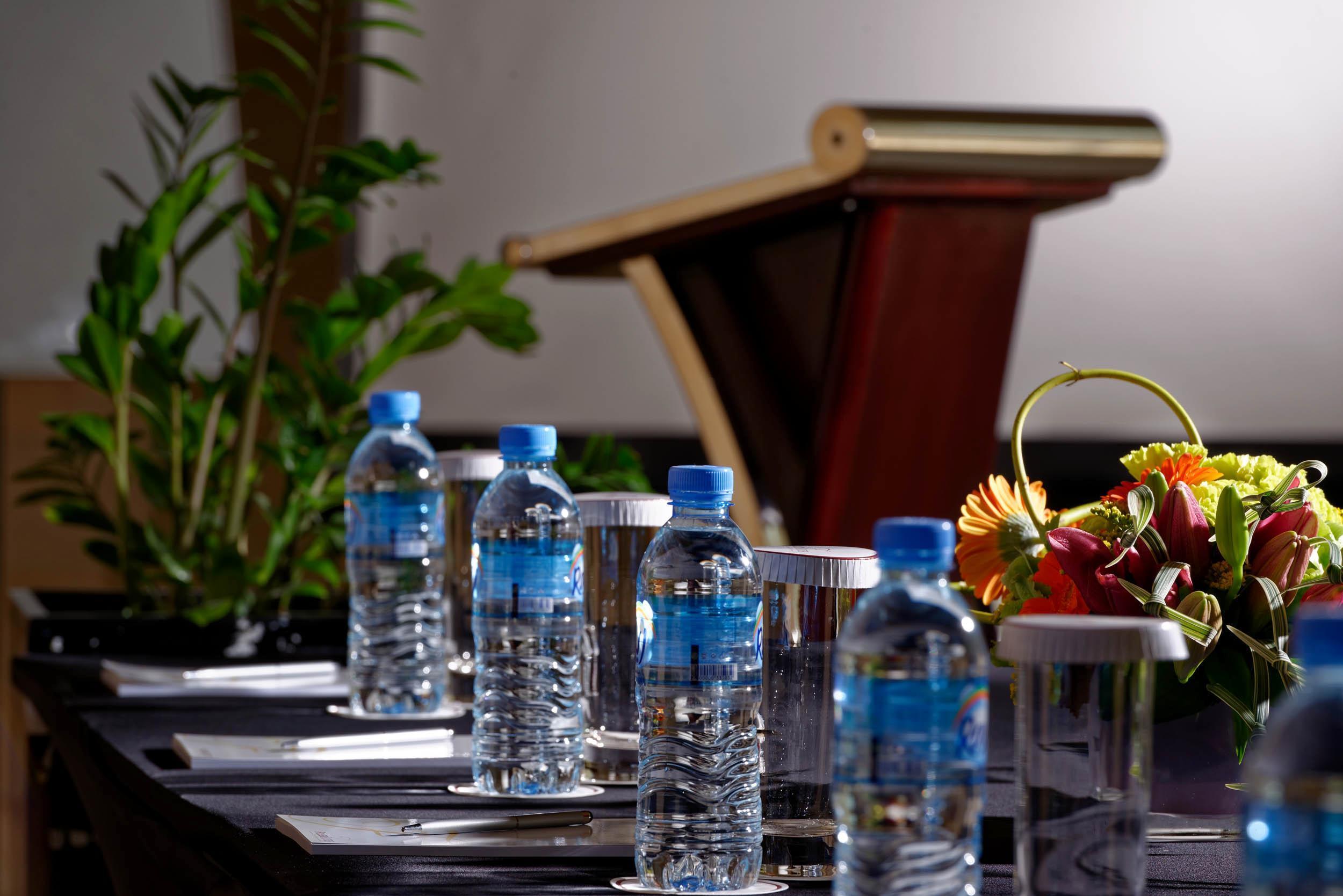 Fraser Suites Doha Exterior photo Bottled water at a meeting